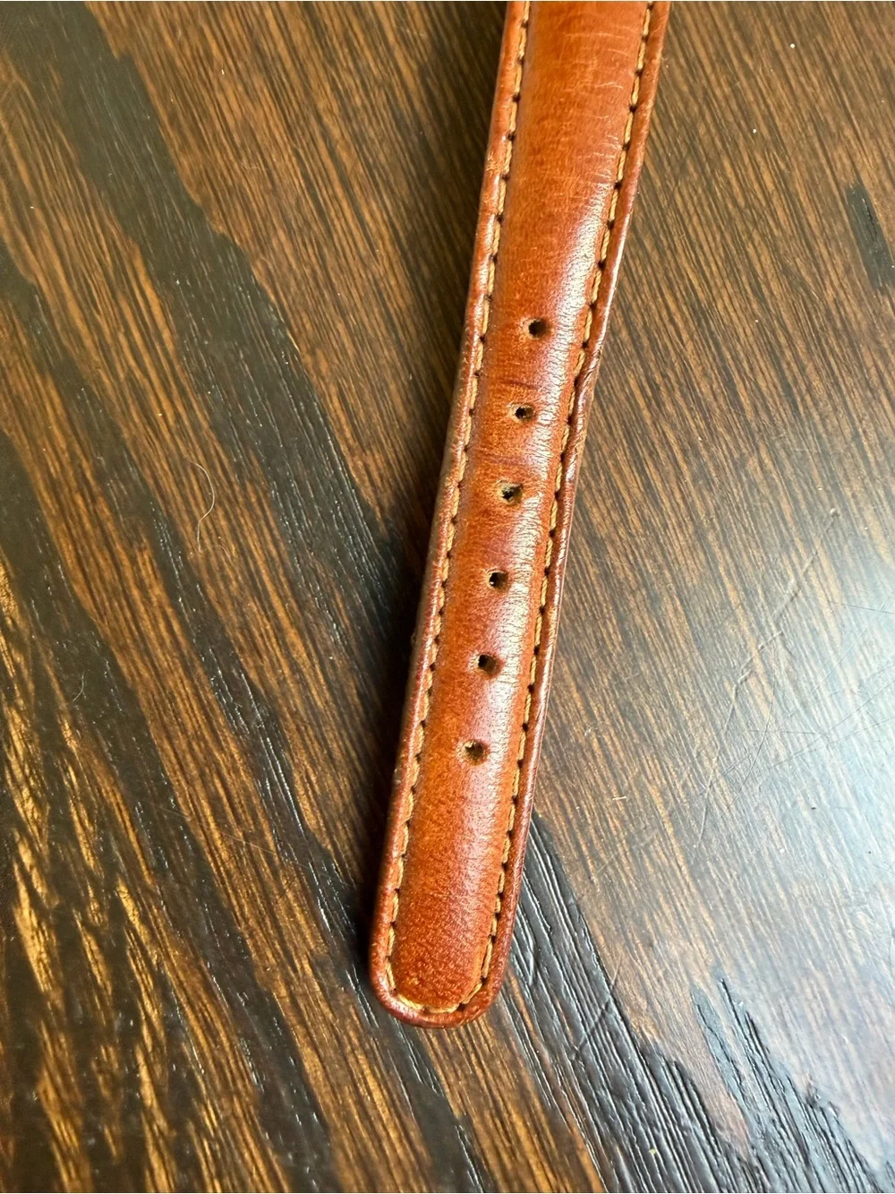 Vintage Fossil watch with a brown leather strap.
